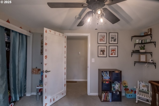 miscellaneous room featuring carpet floors and ceiling fan