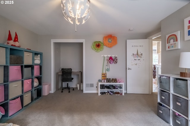 miscellaneous room with a notable chandelier and carpet