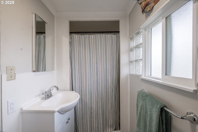 bathroom featuring vanity and walk in shower