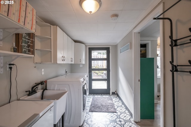 laundry area with cabinets