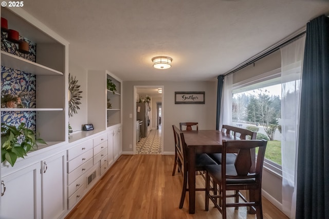 dining space featuring light hardwood / wood-style floors