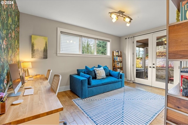 interior space featuring french doors and light hardwood / wood-style floors