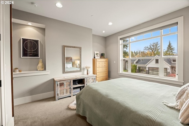 bedroom featuring light colored carpet