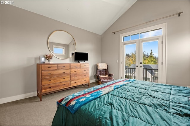 carpeted bedroom featuring multiple windows, vaulted ceiling, access to exterior, and french doors