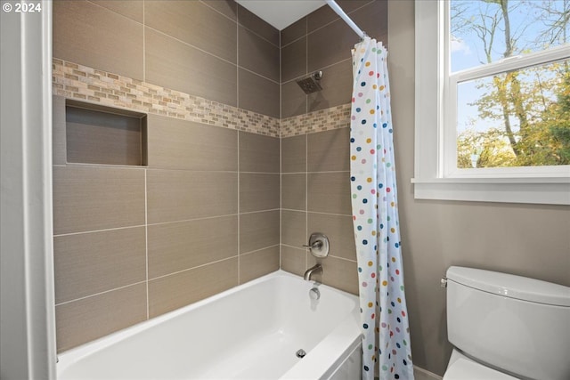 bathroom with toilet and shower / bathtub combination with curtain