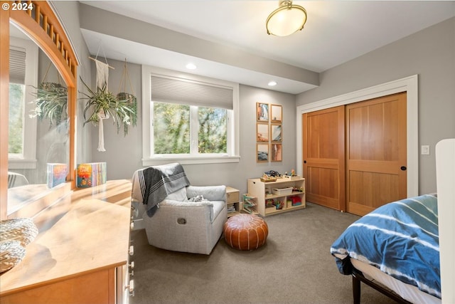 carpeted bedroom with a closet