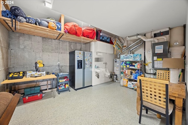 kitchen featuring stainless steel refrigerator with ice dispenser and gas water heater