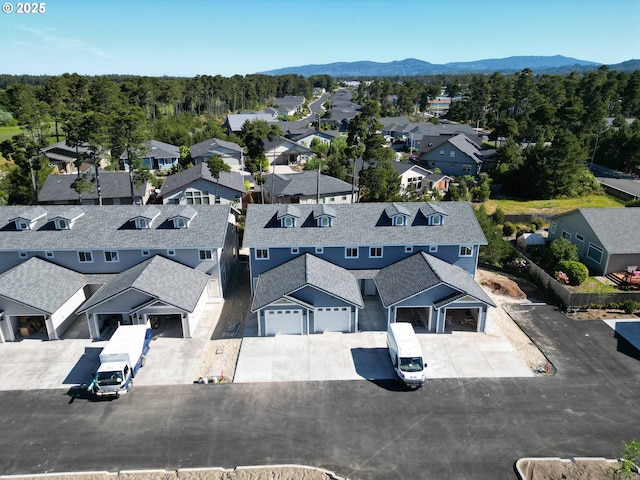1587 37th St, Florence, OR 97439 - aerial perspective of suburban area featuring a mountainous background