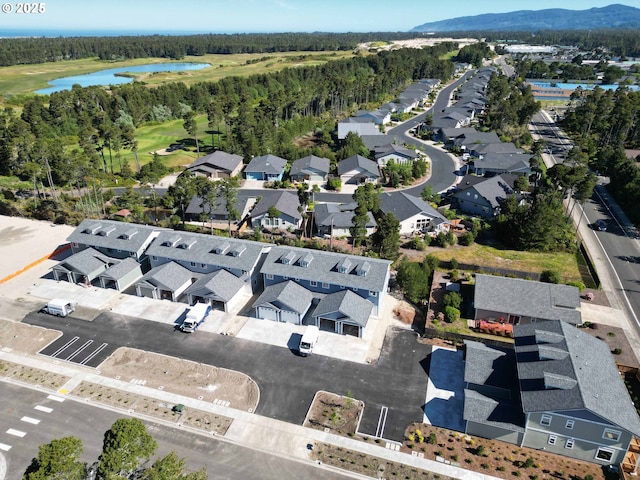 1587 37th St, Florence, OR 97439 - aerial view of property and surrounding area with a water and mountain view, nearby suburban area, and a golf club