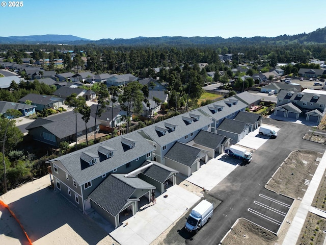 1587 37th St, Florence, OR 97439 - aerial perspective of suburban area with mountains