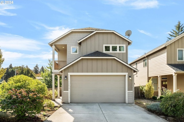 view of front of property featuring a garage and a balcony