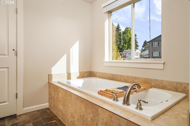 bathroom with tiled tub