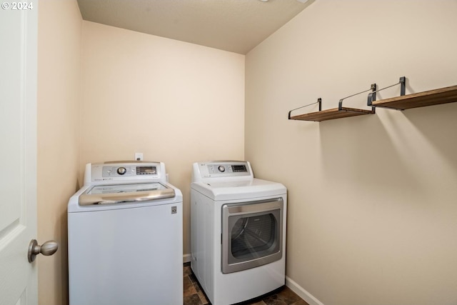 washroom with independent washer and dryer