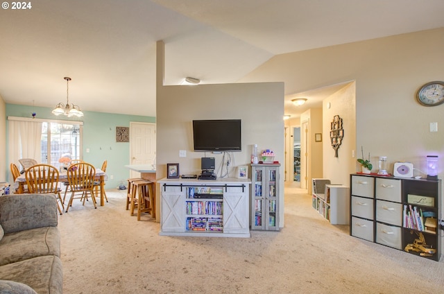 carpeted living room with a chandelier and vaulted ceiling