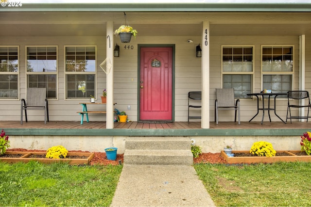 property entrance with covered porch