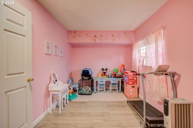 recreation room with light wood-type flooring