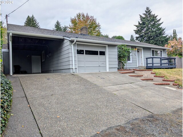 property entrance with a lawn and a deck