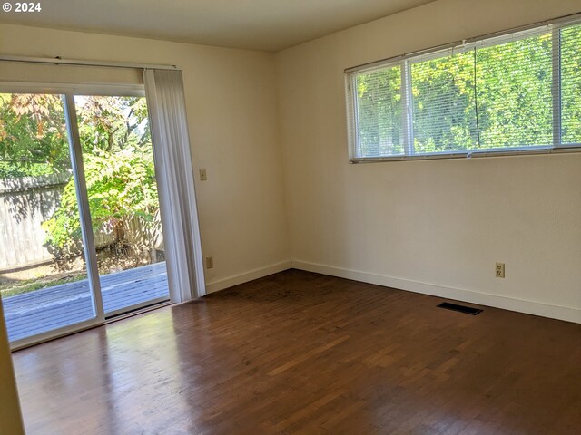 spare room featuring hardwood / wood-style flooring