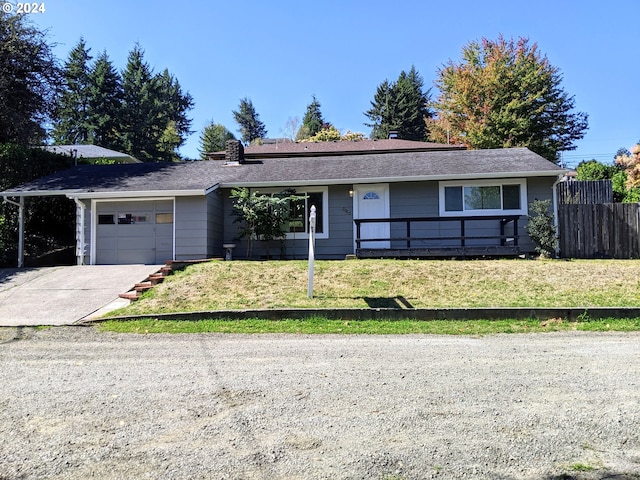 ranch-style house with a garage and a front lawn