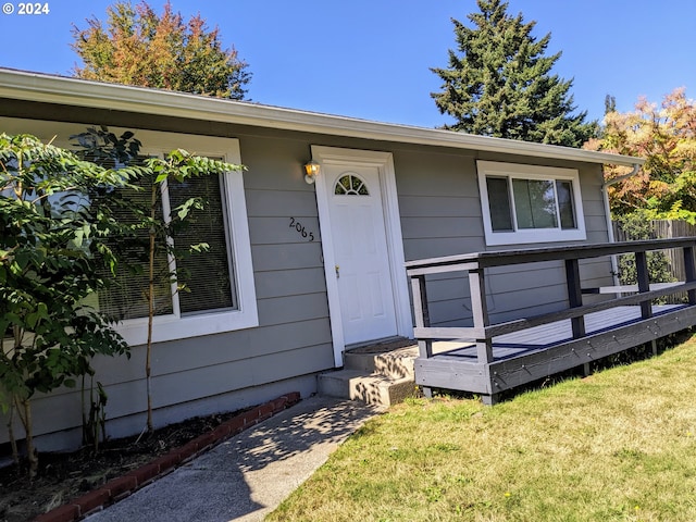 single story home featuring a front yard and a garage