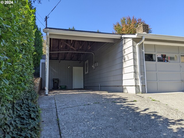 exterior space with a carport