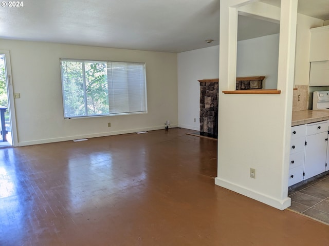 unfurnished living room featuring a fireplace