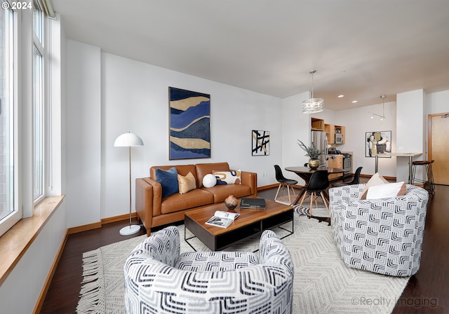 living area featuring wood finished floors and baseboards