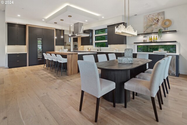 dining space featuring light hardwood / wood-style flooring and sink