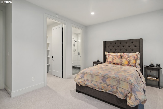 carpeted bedroom with connected bathroom