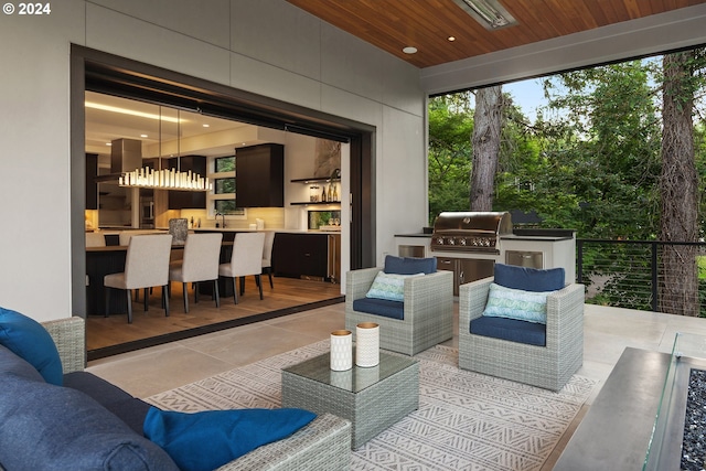 exterior space with sink, an inviting chandelier, and wood ceiling