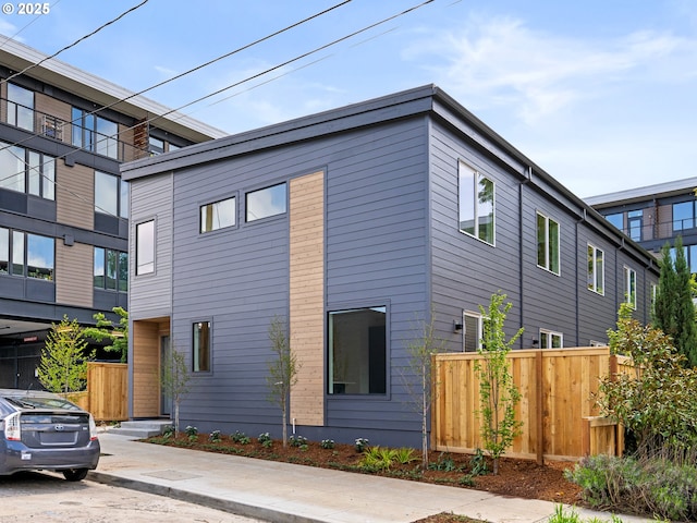 view of property exterior with fence