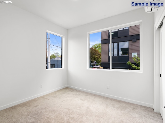 spare room with carpet flooring and baseboards