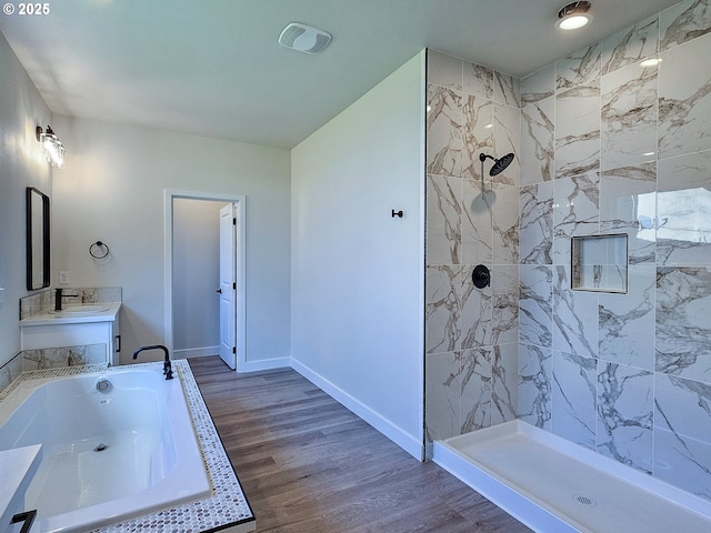 full bathroom with visible vents, baseboards, tiled shower, wood finished floors, and a bath