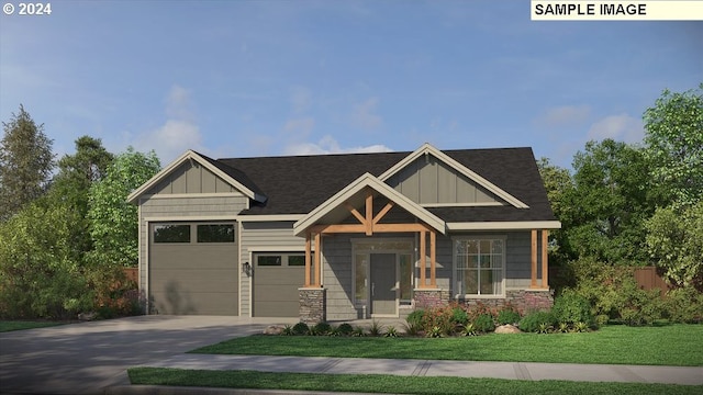 craftsman-style house featuring a front yard and a garage