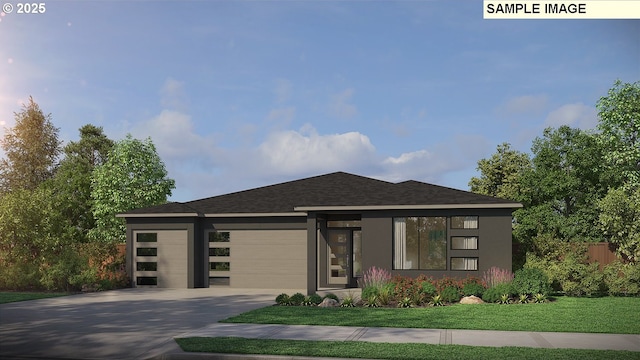 prairie-style home featuring a garage and a front yard