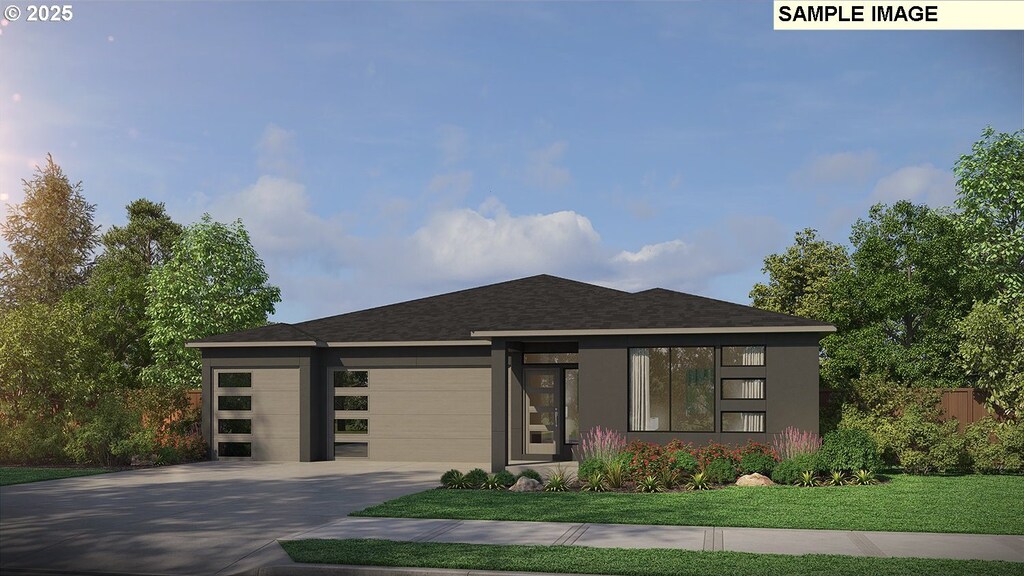 17300 NE 82nd St, Vancouver, WA 98682 - prairie-style house featuring fence, a front lawn, concrete driveway, an attached garage, and a shingled roof