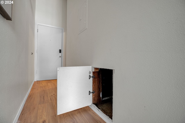 hall with light hardwood / wood-style floors