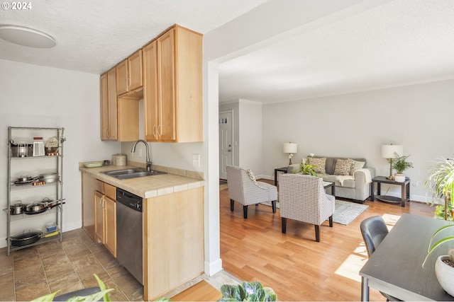 kitchen featuring sink, light hardwood / wood-style flooring, dishwasher, tile countertops, and light brown cabinets