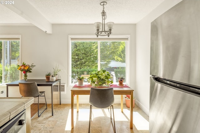 dining room featuring beamed ceiling, a textured ceiling, and a notable chandelier