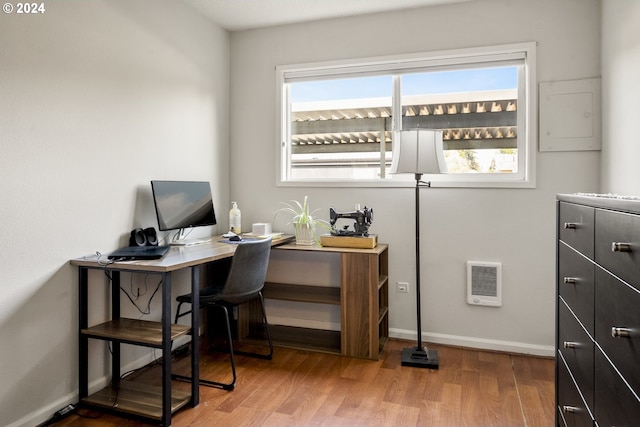 office area with a healthy amount of sunlight and hardwood / wood-style floors