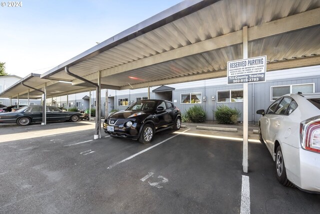 view of parking / parking lot with a carport