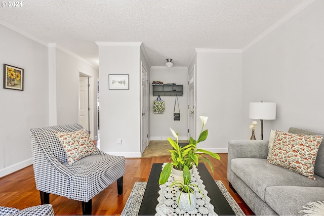 living room featuring crown molding, a textured ceiling, and light hardwood / wood-style flooring