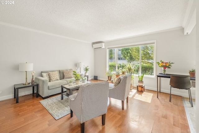 living room with crown molding, a wall mounted air conditioner, a textured ceiling, and light hardwood / wood-style flooring