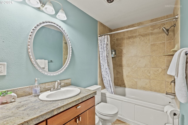 full bathroom featuring vanity, shower / bath combo, and toilet