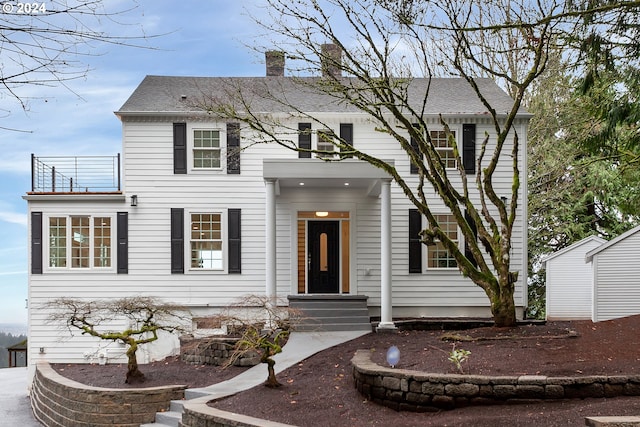 view of front of house with a balcony