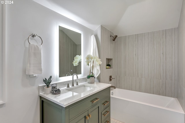 bathroom featuring vanity and tiled shower / bath combo