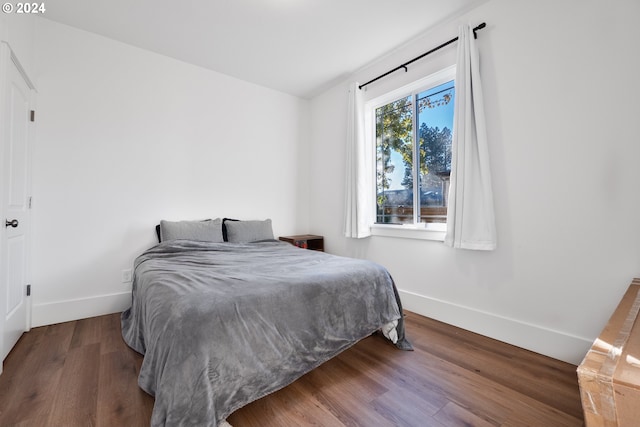 bedroom with hardwood / wood-style flooring