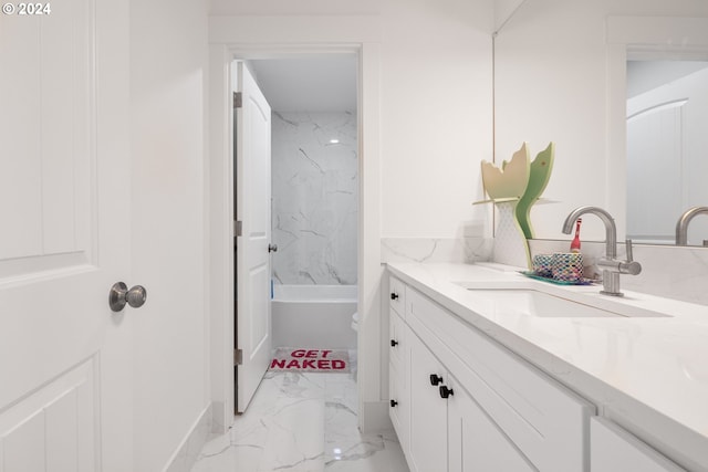 full bathroom featuring vanity, toilet, and tiled shower / bath