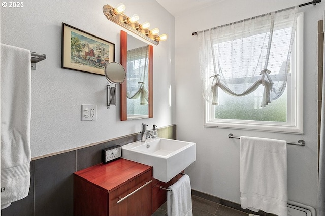 bathroom with tile patterned floors and vanity