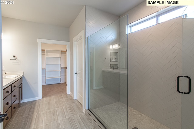 bathroom with vanity and an enclosed shower